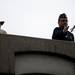 A Ypsilanti Memorial Day Parade participant tosses flowers over the Cross Street Bridge on Monday, May 27. Daniel Brenner I AnnArbor.com